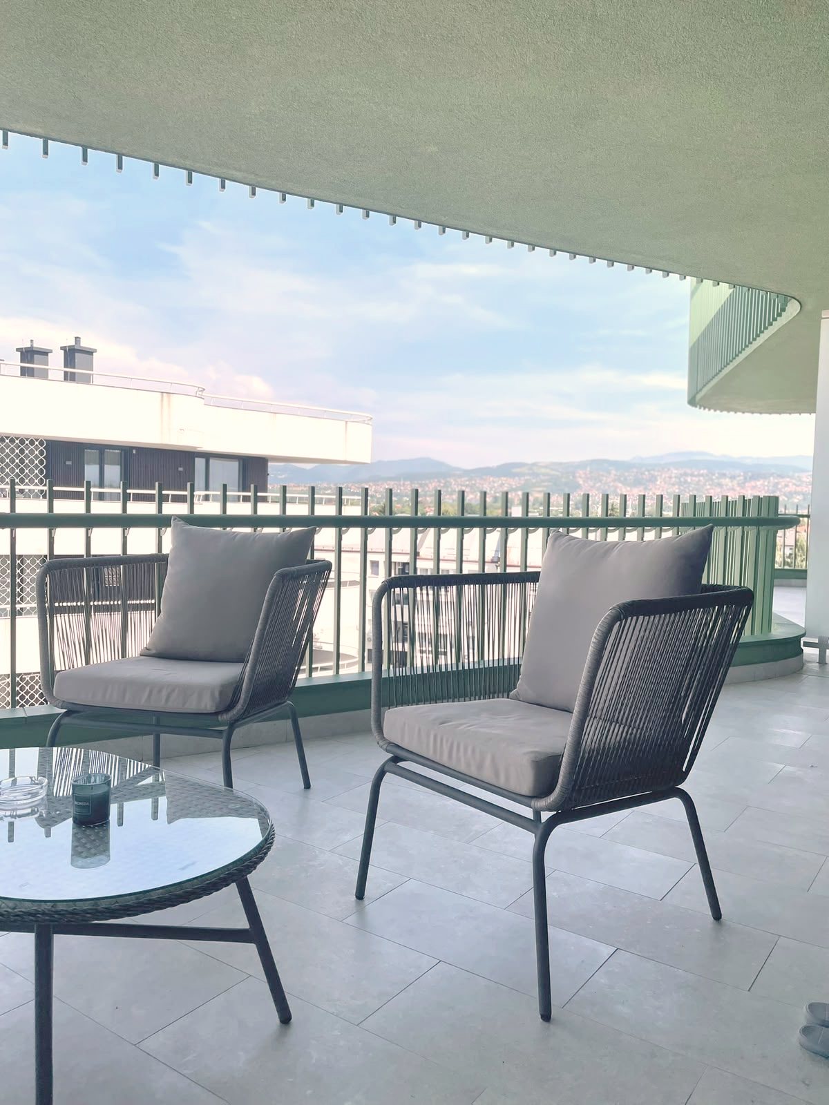 Balcony with lounge chairs and a view over Ilidža